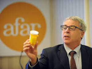 Dr. Nir Barzilai holds a bottle of metformin
